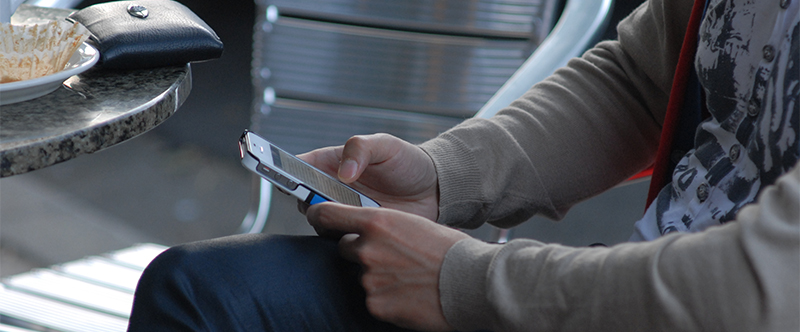 Checking phone at a coffee shop